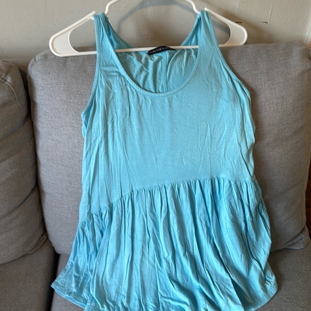 This is a cute turquoise blue sleeveless cotton top in size L